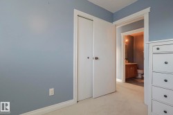 Unfurnished bedroom featuring light carpet, a closet, and a textured ceiling - 