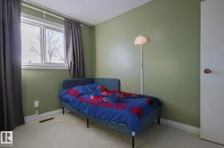 Bedroom featuring carpet flooring and a textured ceiling - 