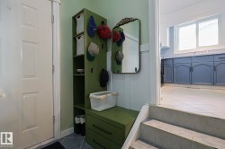 Mudroom featuring dark tile patterned flooring - 