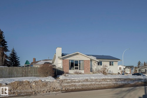 View of front facade with solar panels, a chimney, and brick siding - 192 Dunluce Road, Edmonton, AB - Outdoor