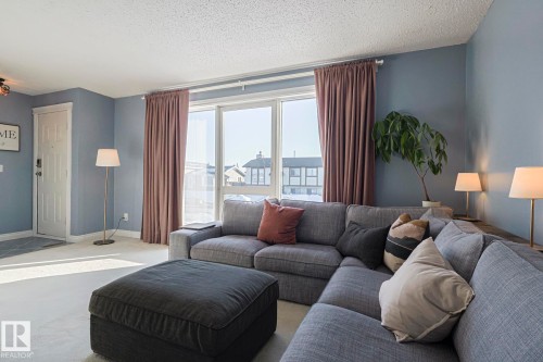 Carpeted living area with a textured ceiling - 192 Dunluce Road, Edmonton, AB - Indoor Photo Showing Living Room