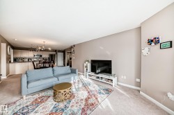 Living area featuring baseboards and carpet floors - 