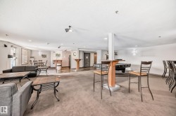 Living room featuring light carpet and recessed lighting - 