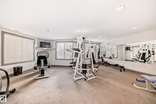 Gym with recessed lighting - 232 530 Hooke Road, Edmonton, AB - Indoor Photo Showing Gym Room
