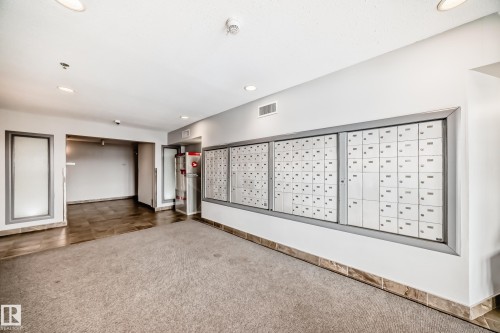 Community lobby with recessed lighting - 232 530 Hooke Road, Edmonton, AB - Indoor Photo Showing Other Room