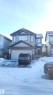 Traditional-style house with an attached garage, stone siding, and concrete driveway - 31 Newgate Way, St. Albert, AB  - Outdoor 