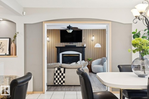 8617 158A Avenue, Edmonton, AB - Indoor Photo Showing Dining Room With Fireplace