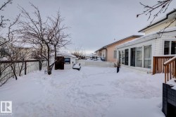 Snowy yard with an outbuilding - 