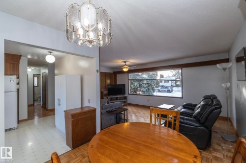 Dining area with ceiling fan and suspended lighting - 9020 152 Avenue, Edmonton, AB - Indoor Photo Showing Dining Room