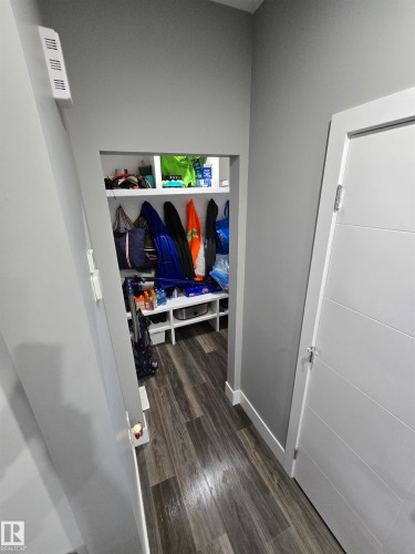 Mudroom featuring dark wood-type flooring and baseboards - 1641 Enright Way Nw, Edmonton, AB - Indoor
