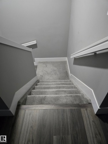Staircase featuring baseboards - 1641 Enright Way Nw, Edmonton, AB - Indoor Photo Showing Other Room