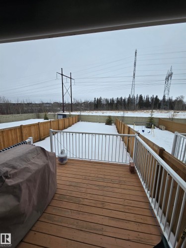 Snow covered deck featuring area for grilling and a fenced backyard - 1641 Enright Way Nw, Edmonton, AB - Outdoor