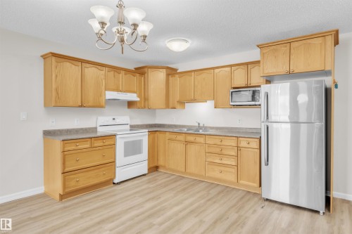 1 5011 Pine Drive, Cherry Grove, AB - Indoor Photo Showing Kitchen With Double Sink