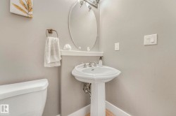 Bathroom featuring toilet and baseboards - 