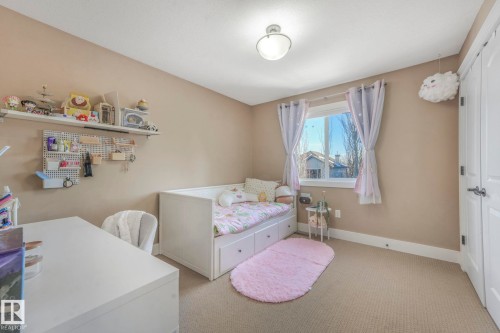 Carpeted bedroom with baseboards - 2307 Rutherford Way, Edmonton, AB - Indoor Photo Showing Bedroom