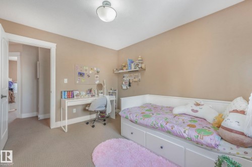 Carpeted bedroom featuring baseboards - 2307 Rutherford Way, Edmonton, AB - Indoor Photo Showing Bedroom