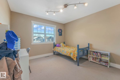 Bedroom featuring carpet flooring - 2307 Rutherford Way, Edmonton, AB - Indoor Photo Showing Bedroom