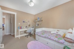 Carpeted bedroom featuring baseboards - 