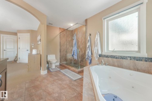 Bathroom with a jetted tub, a shower stall, and vanity - 2307 Rutherford Way, Edmonton, AB - Indoor Photo Showing Bathroom