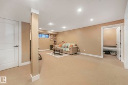 Living room featuring light carpet and recessed lighting - 