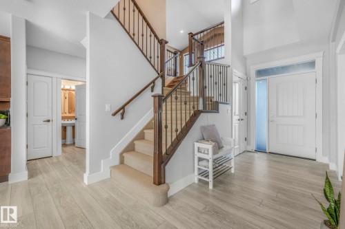 Entryway featuring a towering ceiling, light wood finished floors, and stairway - 2307 Rutherford Way, Edmonton, AB - Indoor Photo Showing Other Room