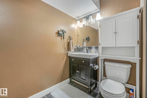 Bathroom featuring vanity and tile patterned floors - 2307 Rutherford Way, Edmonton, AB - Indoor Photo Showing Bathroom