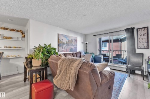 228 6076 Schonsee Way, Edmonton, AB - Indoor Photo Showing Living Room