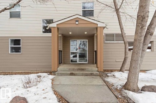 View of snow covered property entrance - 103 12110 119 Ave, Edmonton, AB - Outdoor