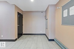 Empty room featuring baseboards and a textured ceiling - 