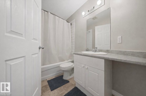 Full bathroom with shower / tub combo and vanity - 103 12110 119 Ave, Edmonton, AB - Indoor Photo Showing Bathroom