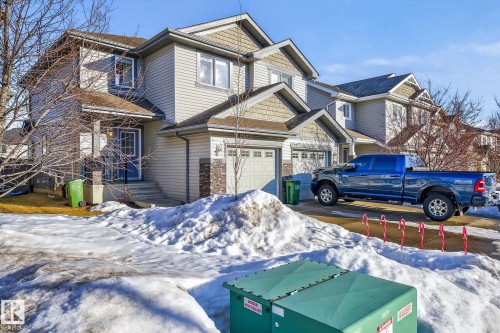 Craftsman house with an attached garage and stone siding - 2338 Casselman Crescent, Edmonton, AB - Outdoor