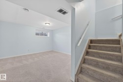 Stairway with carpet floors and baseboards - 