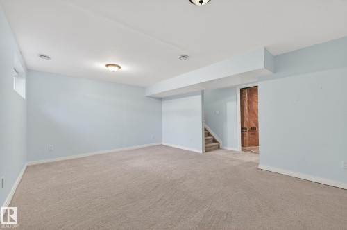 Spare room featuring stairs and carpet - 2338 Casselman Crescent, Edmonton, AB - Indoor