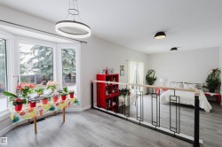 Dining room with light wood-style floors and plenty of natural light - 