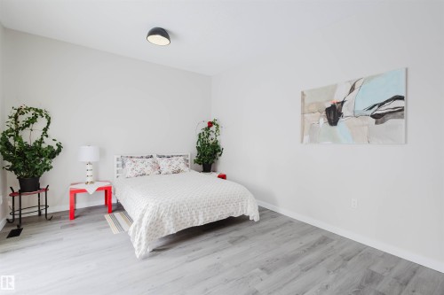 Bedroom featuring wood finished floors and baseboards - 10423 35 Avenue, Edmonton, AB - Indoor Photo Showing Bedroom