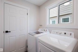 Laundry area with washer and clothes dryer - 