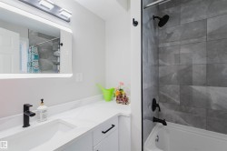 Full bath featuring vanity and shower / bathtub combination with curtain - 