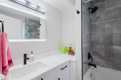 Full bath with vanity and shower / tub combo - 