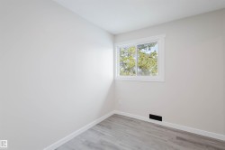 Unfurnished room featuring baseboards and light wood finished floors - 