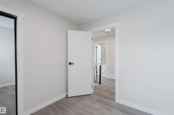 Unfurnished bedroom featuring baseboards and light wood-style floors - 