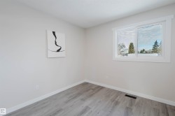 Spare room with baseboards and wood finished floors - 