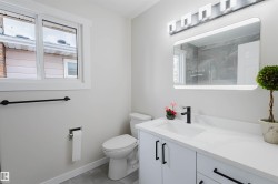 Bathroom featuring vanity and a shower - 