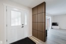 Entrance foyer featuring healthy amount of natural light and light wood-style flooring - 10423 35 Avenue, Edmonton, AB  - Indoor Photo Showing Other Room 