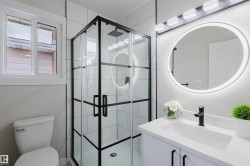 Full bathroom with vanity and a shower stall - 