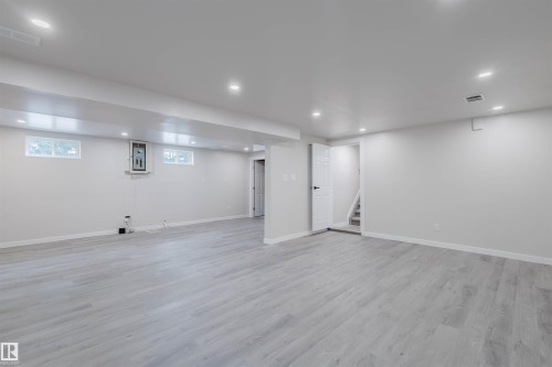 Basement with recessed lighting and light wood-style floors - 10423 35 Avenue, Edmonton, AB - Indoor Photo Showing Basement