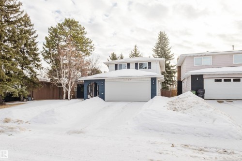 Traditional home featuring a garage and brick siding - 10423 35 Avenue, Edmonton, AB - Outdoor With Facade