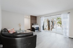 Living area featuring wood finished floors and baseboards - 