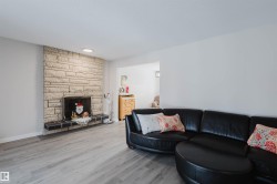 Living area featuring a fireplace and wood finished floors - 