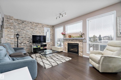 1105 Klarvatten Cove, Edmonton, AB - Indoor Photo Showing Living Room With Fireplace