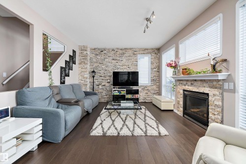1105 Klarvatten Cove, Edmonton, AB - Indoor Photo Showing Living Room With Fireplace
